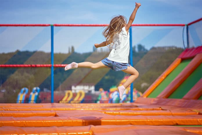 girl having fun at trampoline park